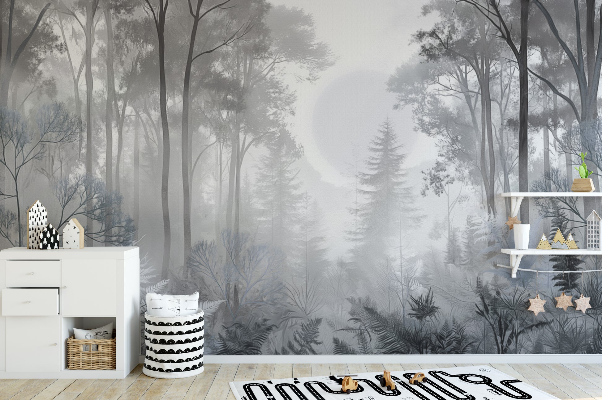 Misty Monochrome Forest wall mural in grey behind a white dresser and toy shelf in a Scandinavian nursery with wooden toys