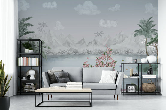 Misty Mountain Lake Escape wall mural behind a gray sofa flanked by black shelving in a living room