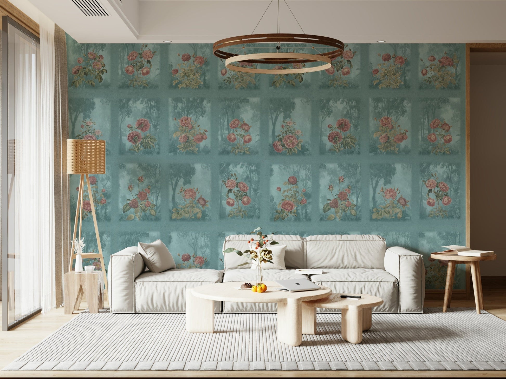 Moody forest mural with soft pink blossoms for a living room feature wall.