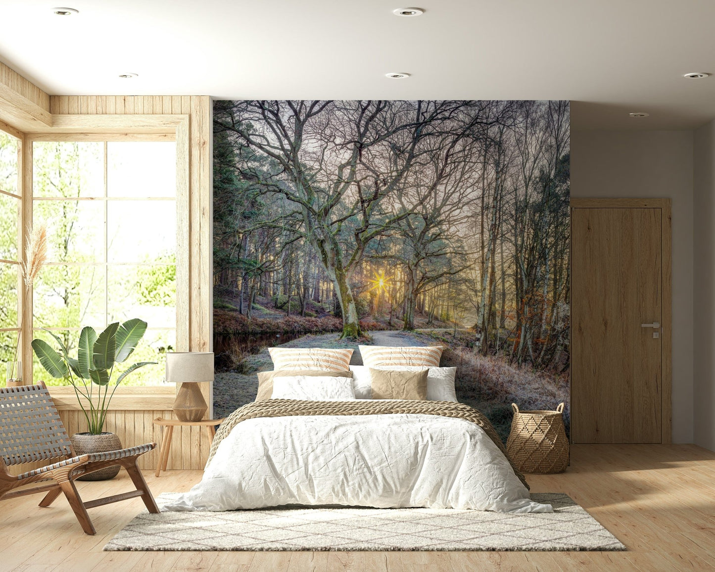 Misty Woodland Glare mural behind a white bed with woven baskets and a window seat holding a leafy plant