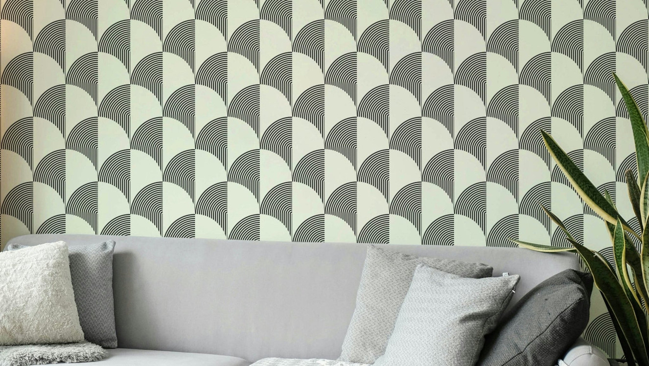 A modern wall mural with a repeating geometric arc pattern.

