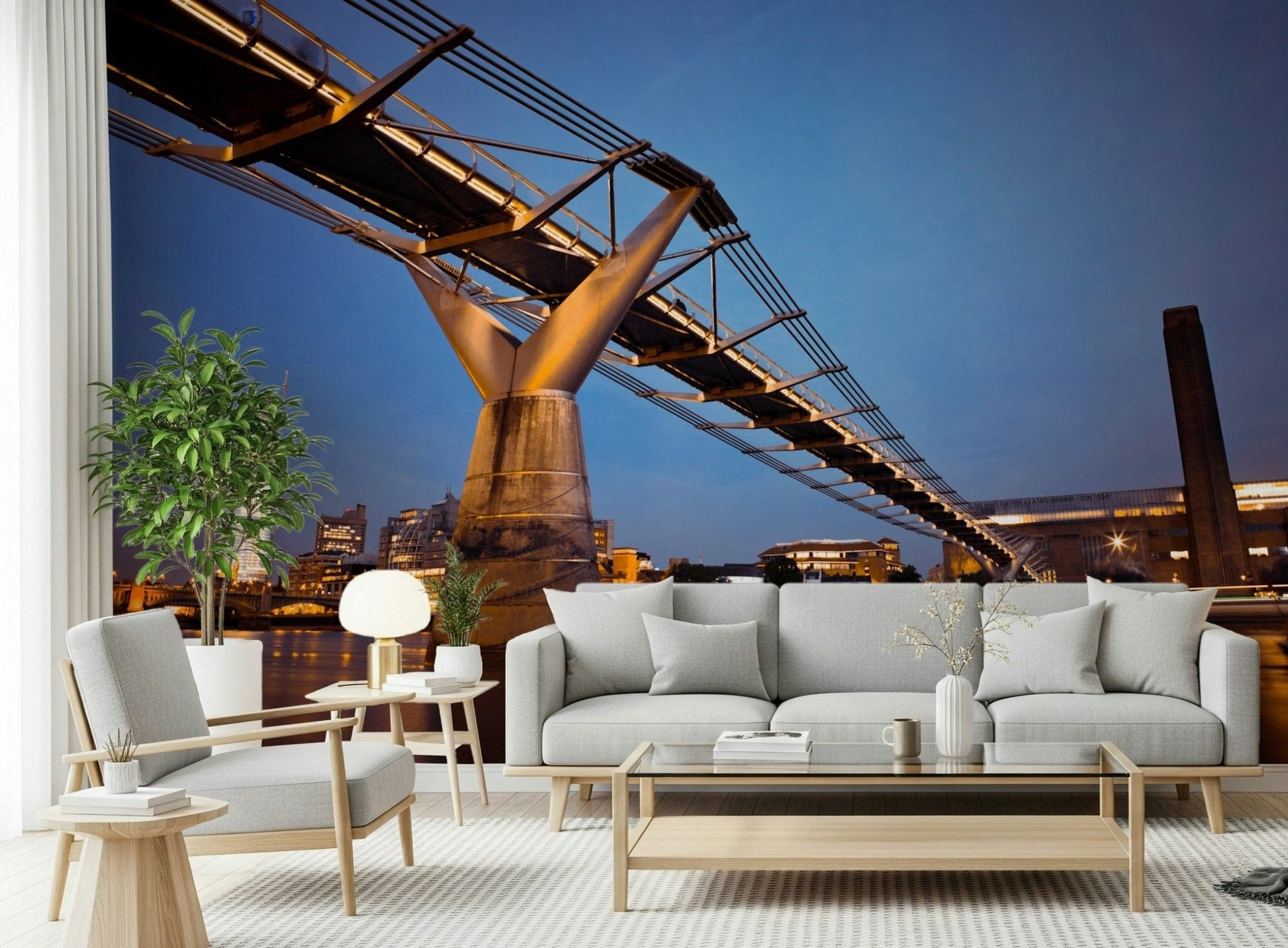 Modern Meets Classic wallpaper mural of the golden bridge and blue sky behind a grey sofa and ficus in a living room