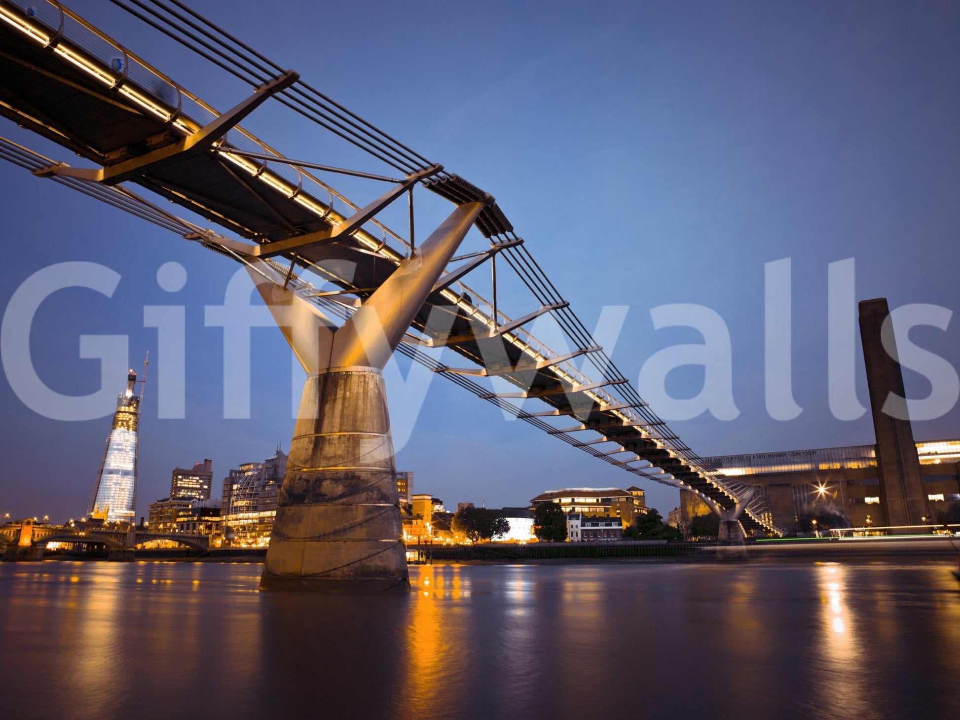 Modern Meets Classic wallpaper mural showing the lit Millennium Bridge, The Shard and Tate Modern over the Thames at dusk