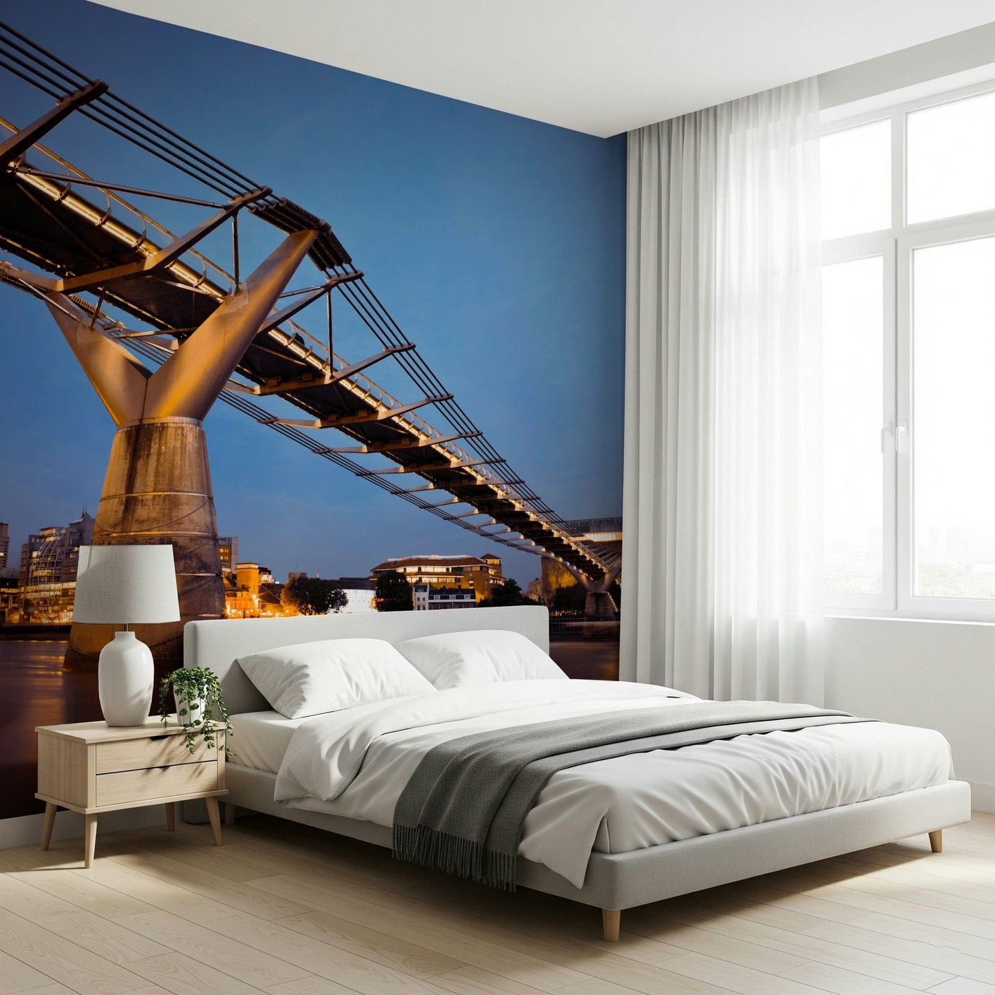 Modern Meets Classic wallpaper mural of the lit bridge at dusk behind a white bed with grey throw in a bedroom