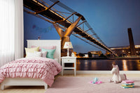 Modern Meets Classic wallpaper mural of the lit bridge behind a pink ruffle bed and unicorn toy in a girls bedroom