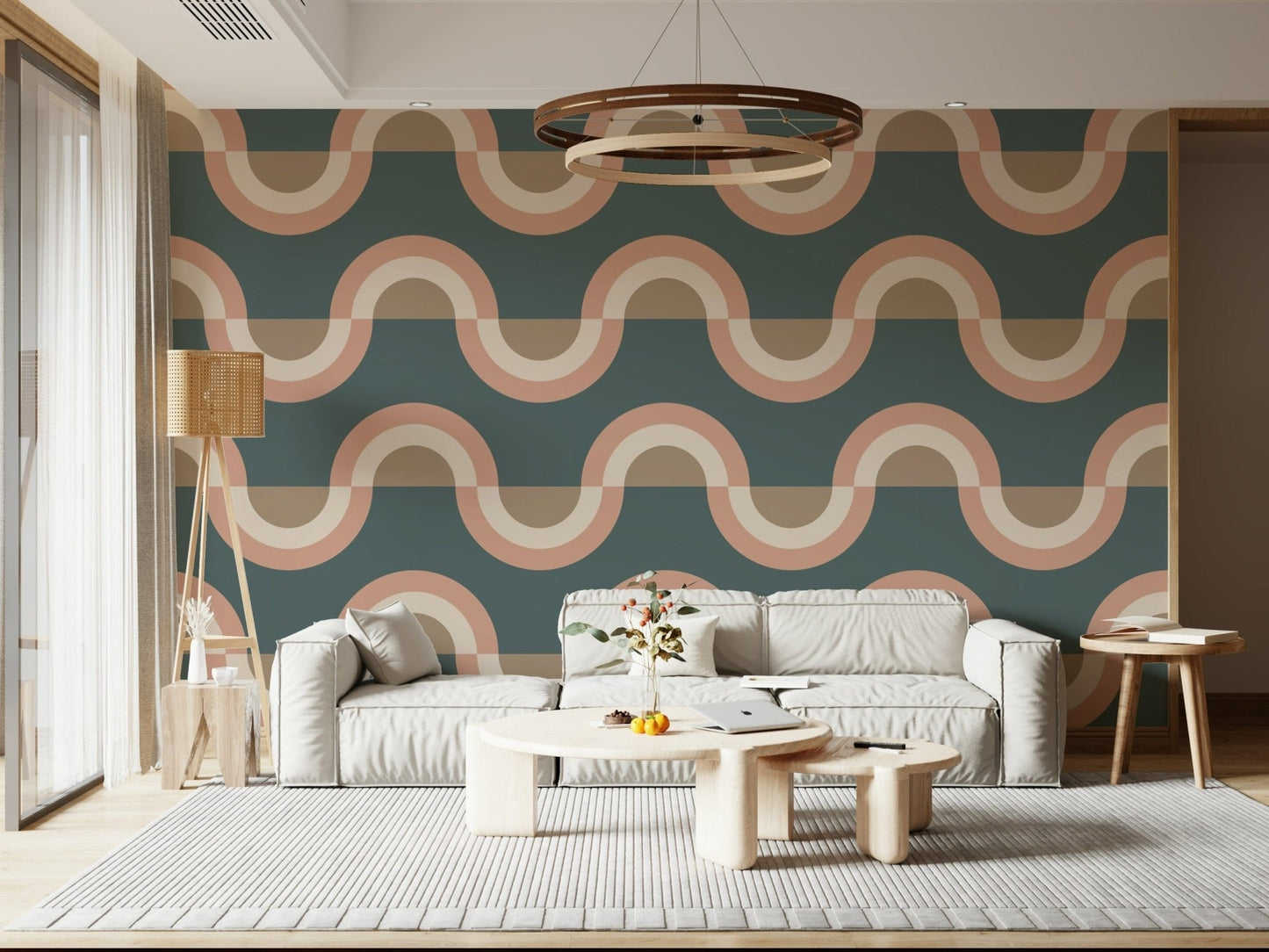 Modern Retro Arcs Decor wallpaper mural with teal peach waves behind a cream sofa and wood ring chandelier in a living room