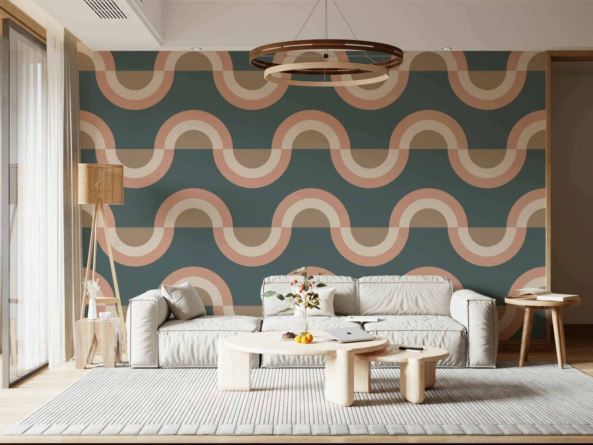 Modern Retro Arcs Decor wallpaper mural with teal peach waves behind a cream sofa and wood ring chandelier in a living room