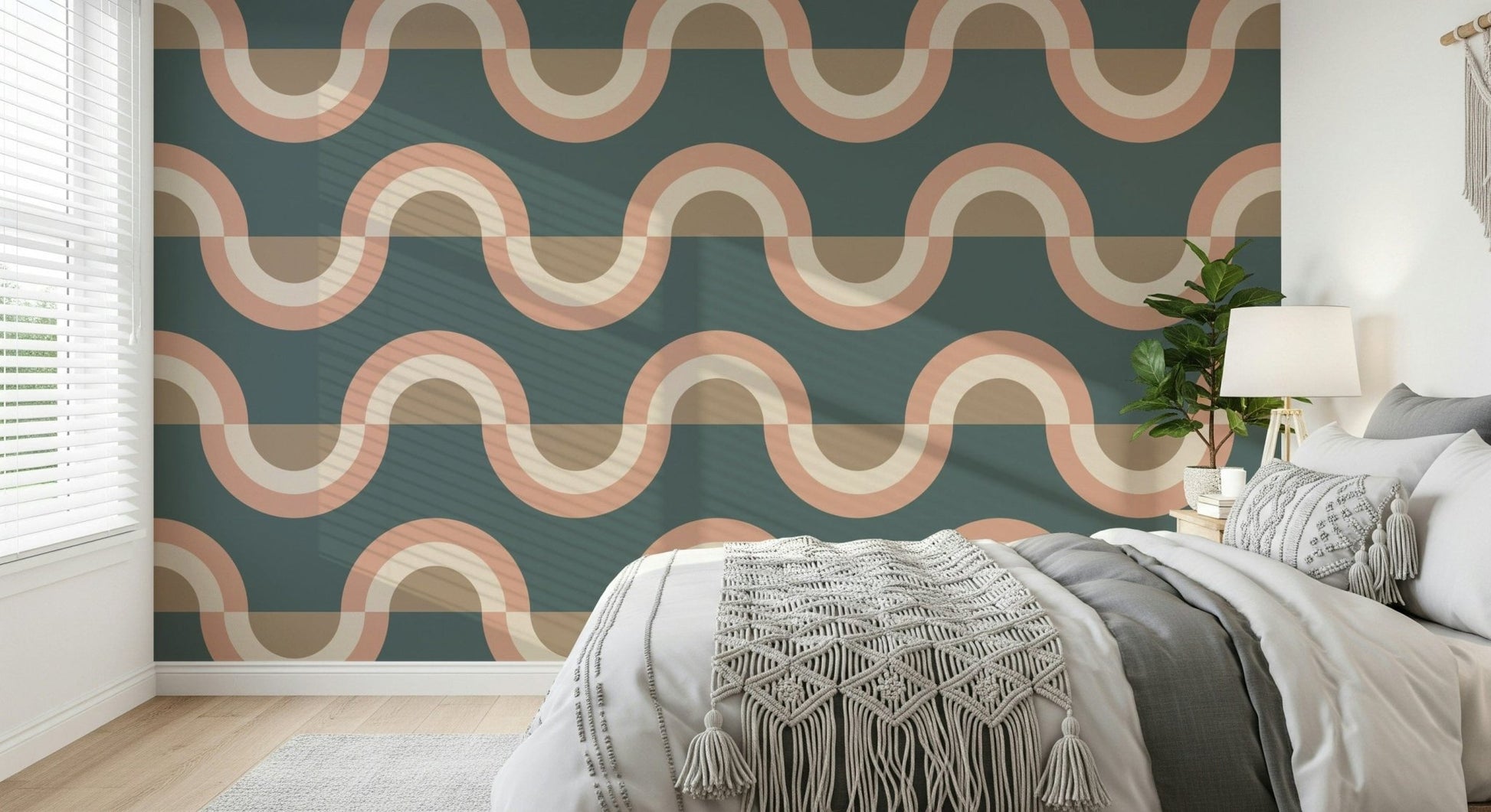 Modern Retro Arcs Decor wallpaper mural in teal and peach behind a grey bed with a macrame throw in a cozy bedroom