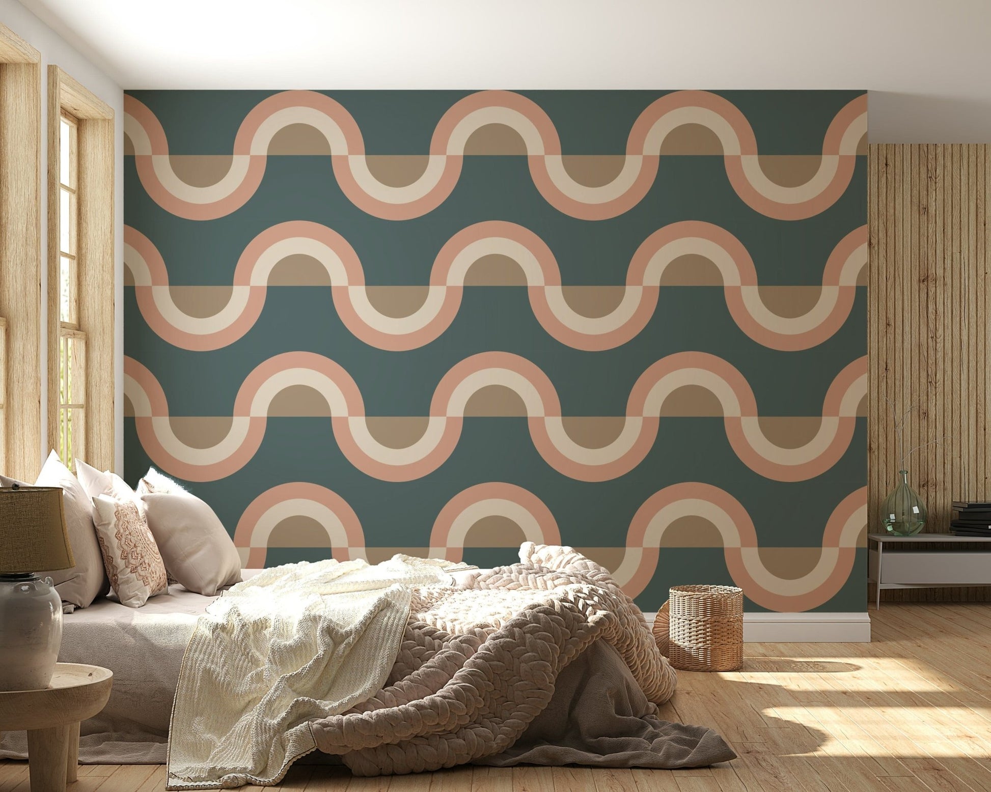 Modern Retro Arcs Decor wallpaper mural with teal and peach waves behind a beige bed and chunky knit throw in a bedroom