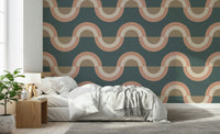 Modern Retro Arcs Decor wallpaper mural with teal and peach retro waves behind a white bed and wood nightstand in a bedroom