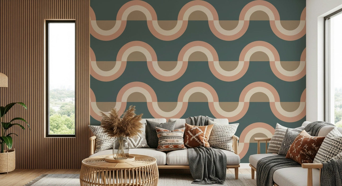 Modern Retro Arcs Decor wallpaper mural with teal and terracotta waves behind a cream sofa and rattan table in a living room