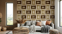 Modern Textured Geometries Earthy wallpaper behind a white sofa with rust cushions and a rattan table