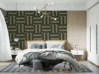 Modern Textured Signs Olive wallpaper as a headboard accent wall behind a bed and gold chandelier in a bedroom