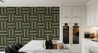 Modern Textured Signs Olive wallpaper in olive green behind a white marble island and black chairs in a kitchen