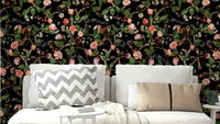 Colorful wallpaper with mischievous monkeys and tropical blooms.


