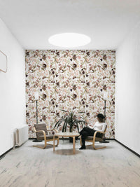 Wallpaper with a monkey tea party scene and botanical accents.

