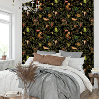 Tropical mural featuring monkeys, vibrant flowers, and green vines.

