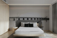A wall mural of a bridge in a monochrome color scheme.

