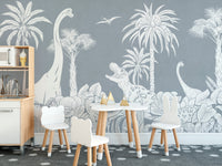 Monochrome Dino Blue wallpaper mural in grey and white dinosaurs above a kids play kitchen and round table set