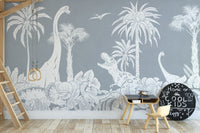 Monochrome Dino Blue wallpaper mural of grey dinosaur jungle behind a loft bed ladder, black table and chalkboard