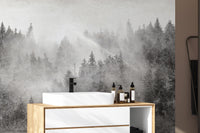 Monochrome woodland wallpaper with dense pines
