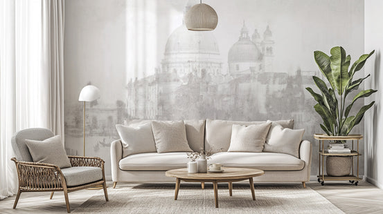 Monochrome Venice cityscape wallpaper mural with misty grey domes behind a beige sofa in a living room