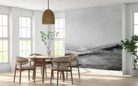 Abstract wallpaper with layered grayscale landscapes creating depth and perspective.
