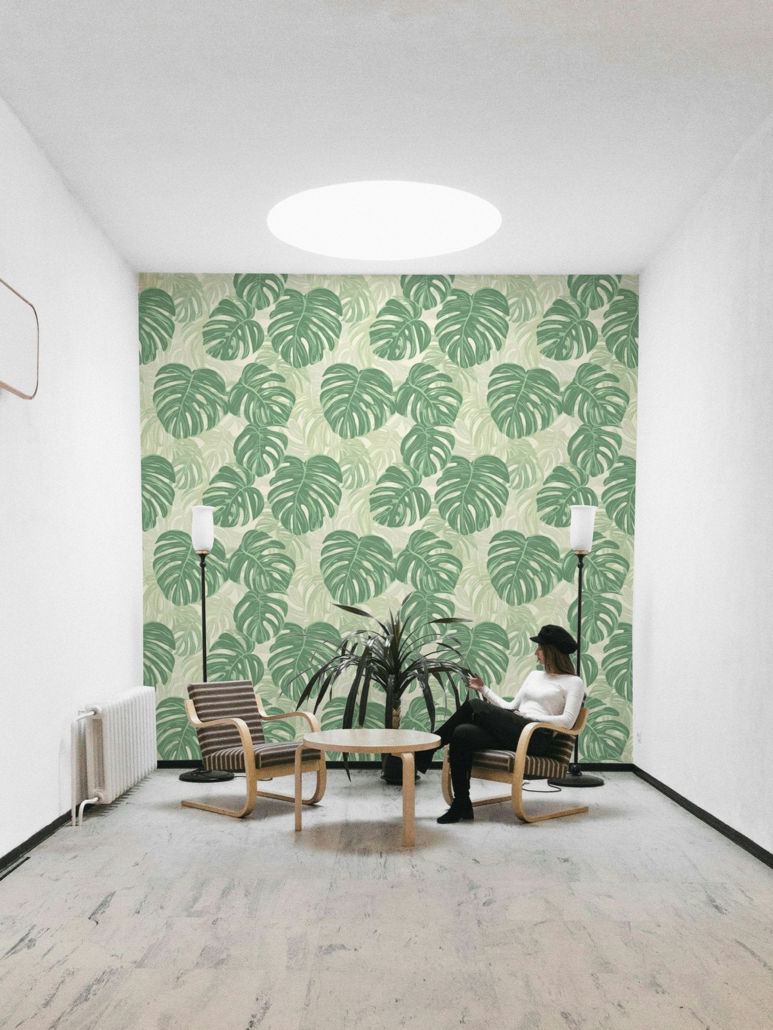 Tropical monstera leaf mural for a nature-inspired room.

