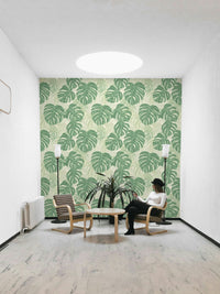 Tropical monstera leaf mural for a nature-inspired room.

