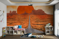 Sunset over sand dunes and rocky peaks on a bespoke wall mural.