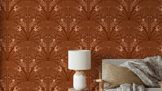 Jungle Berry Thief Moon Monkey and Bird wallpaper in rust tones in a bedroom with a white lamp and grey bed