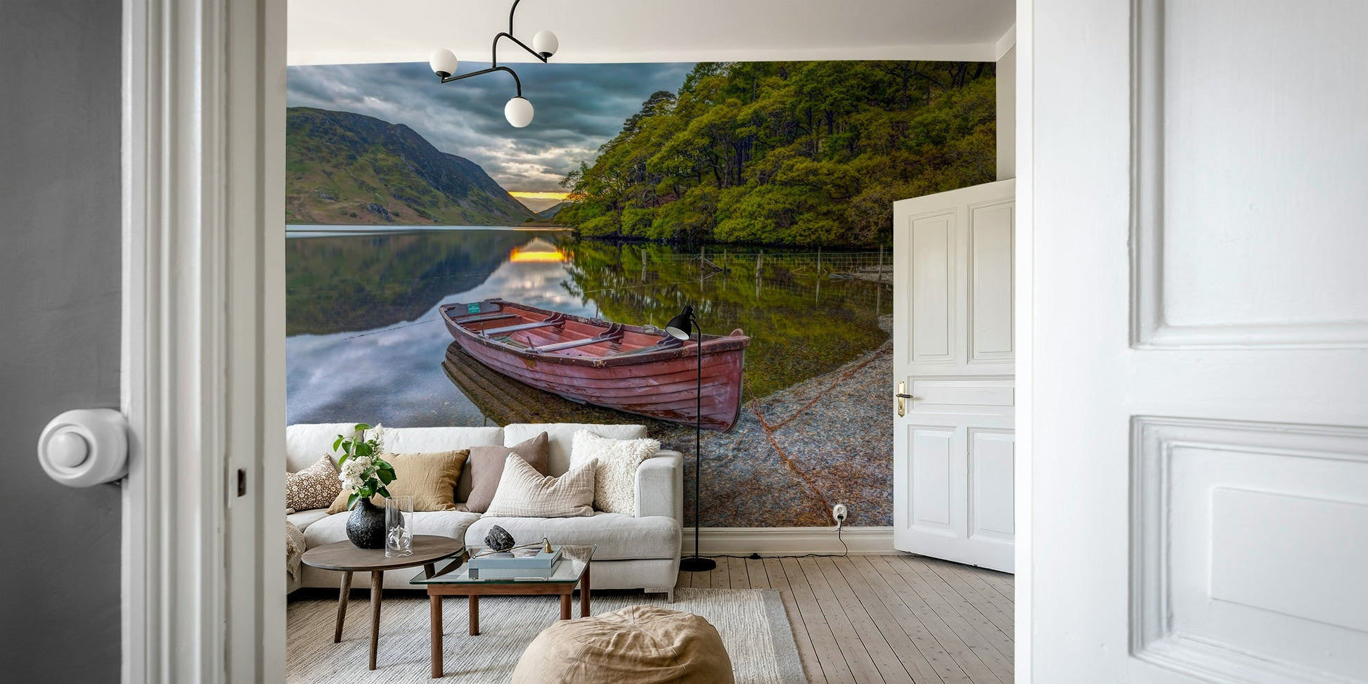 A wall mural featuring a peaceful lake scene.

