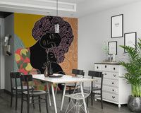 Mother's Embrace wall mural with a boho portrait behind a white dining table and wire chairs in a dining room