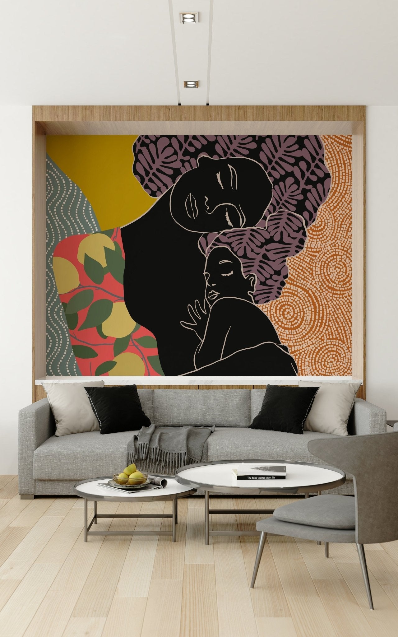 Mother's Embrace wall mural of a mother-and-child silhouette behind a grey sofa and round coffee tables