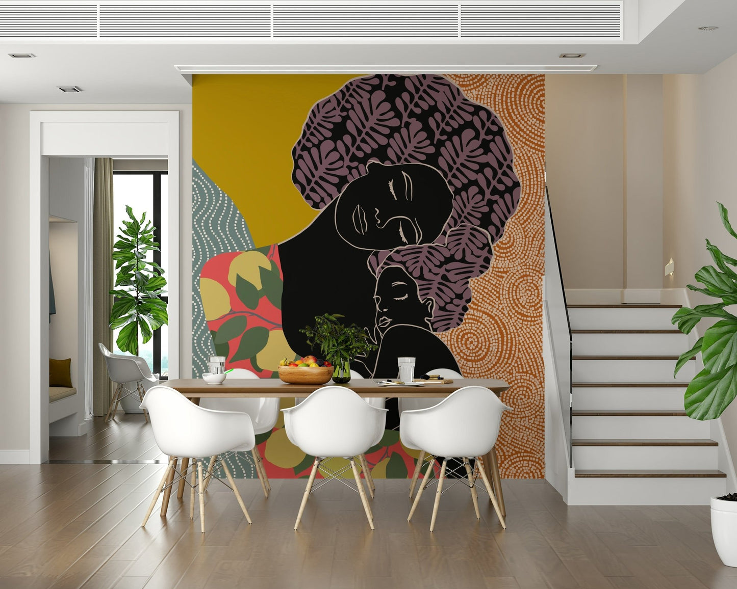 Mother's Embrace wall mural of a mother and child behind a wood dining table with white Eames-style chairs