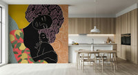 Mother's Embrace wall mural of a mother holding a child beside a wood dining table and kitchen cabinets