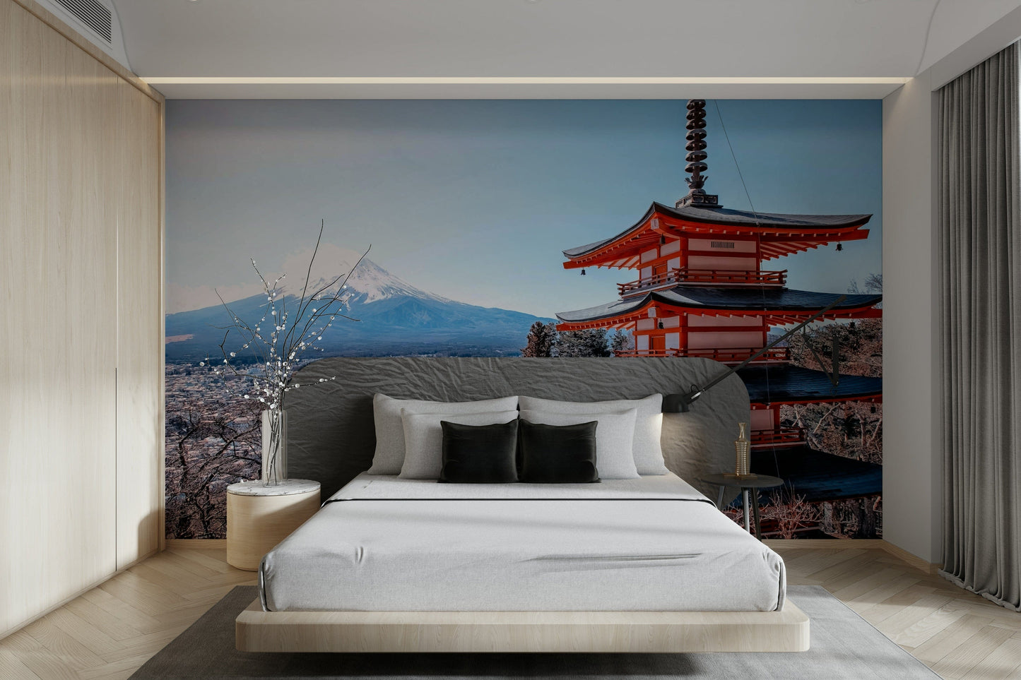 Tranquil Pagoda Peak wallpaper mural showing the red pagoda and snowy Mount Fuji above a grey upholstered bed in a bedroom