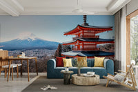 Tranquil Pagoda Peak wallpaper mural with the red pagoda and Mount Fuji behind a blue sofa and dining table in a living room