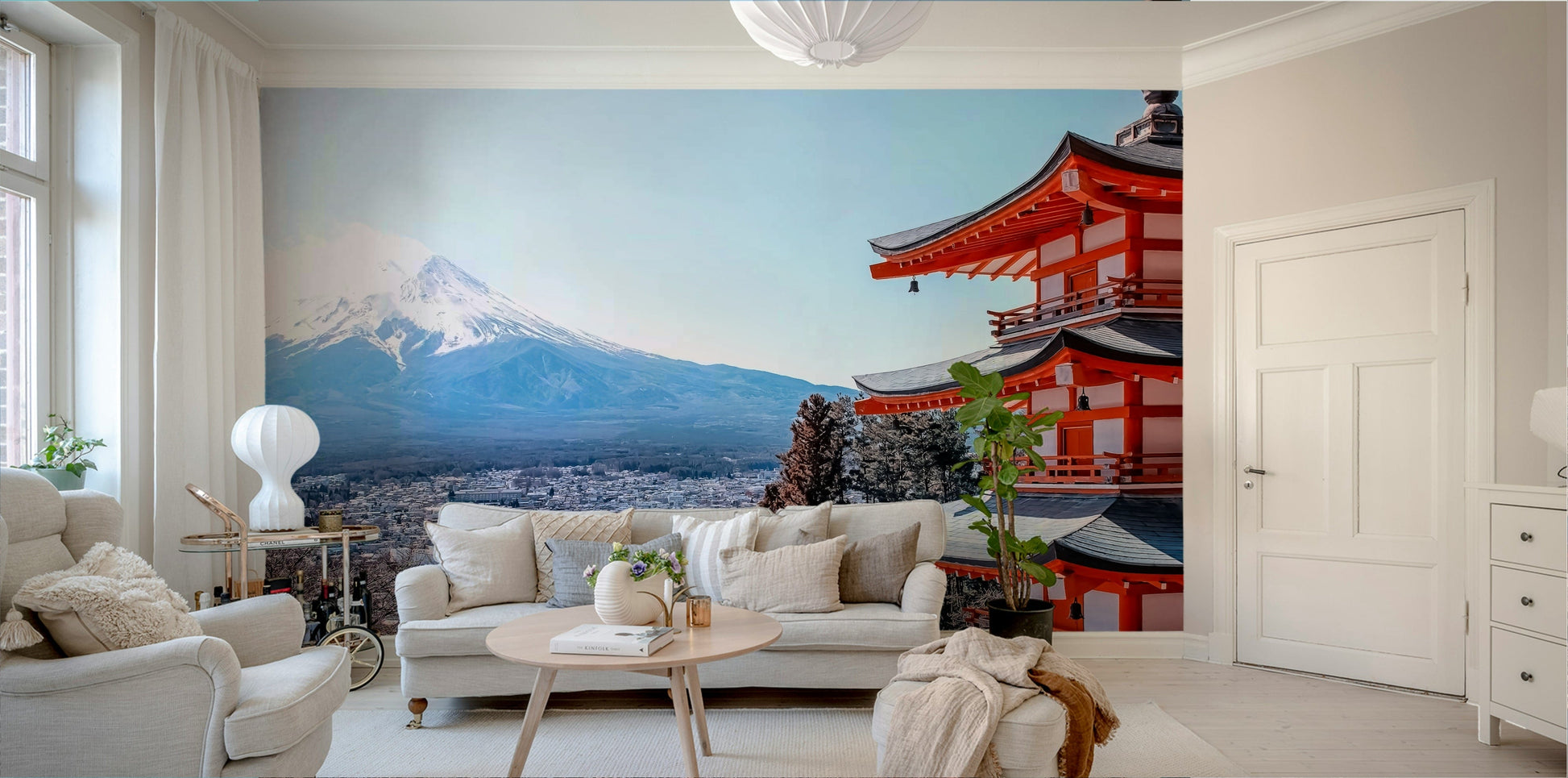 Tranquil Pagoda Peak wallpaper mural with the red pagoda and Mount Fuji behind a cream sofa and armchairs in a living room