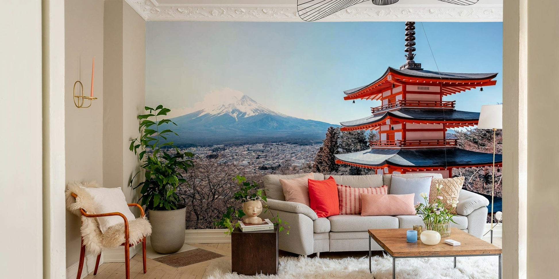 Tranquil Pagoda Peak wallpaper mural of the red pagoda and Mount Fuji behind a cream sofa and sheepskin armchair