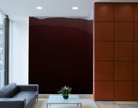 A living room with the mountain landscape wall mural.

