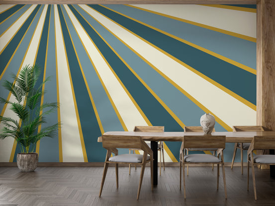 Multicolor Abstract Striped Line wallpaper mural with teal, cream and gold sunburst rays in a dining room with wood table and palm