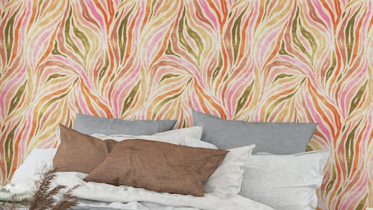 Multicolor Textured Zebra Print wallpaper in pink and orange behind a gray and brown pillowed bed in a bedroom