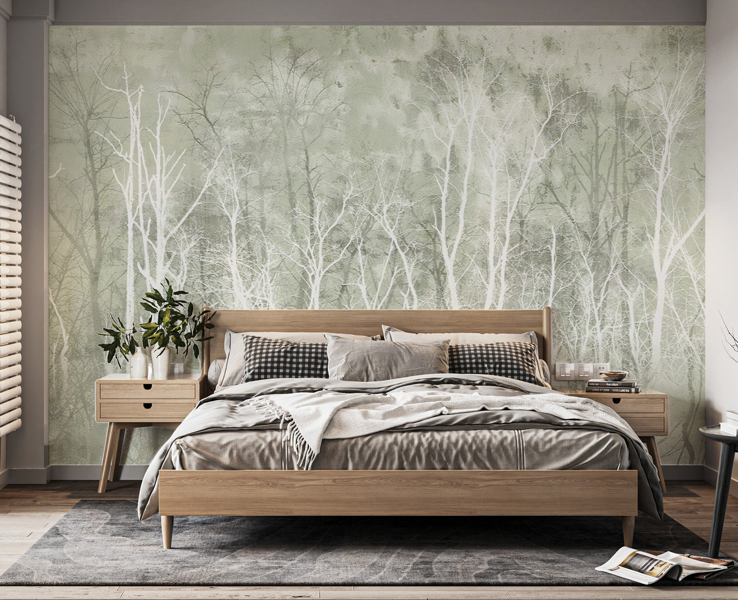 Serene green wall mural featuring delicate tree silhouettes
