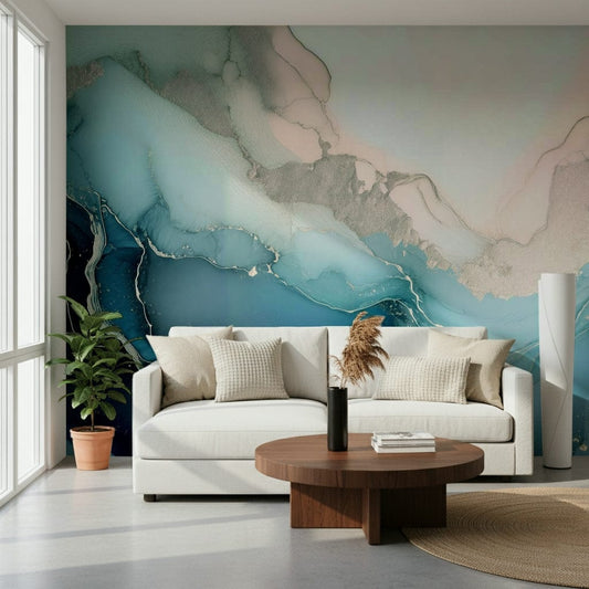 Mystic Mineral Layers wallpaper mural in teal ink behind a white sofa, fiddle-leaf plant and walnut coffee table
