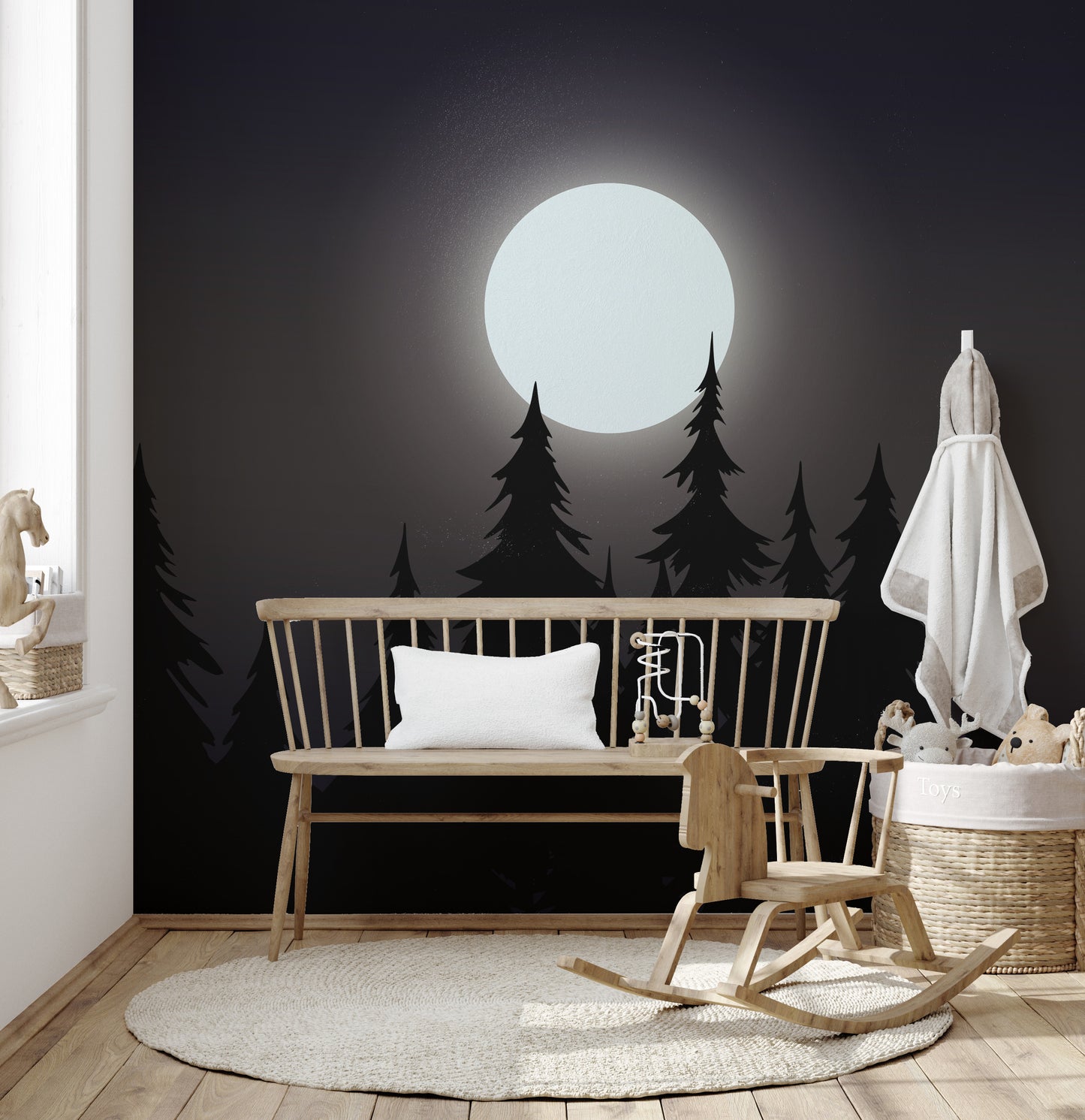 Mystical Moonlit Forest wallpaper with moon and black pines behind a wood bench and rocking horse in a nursery