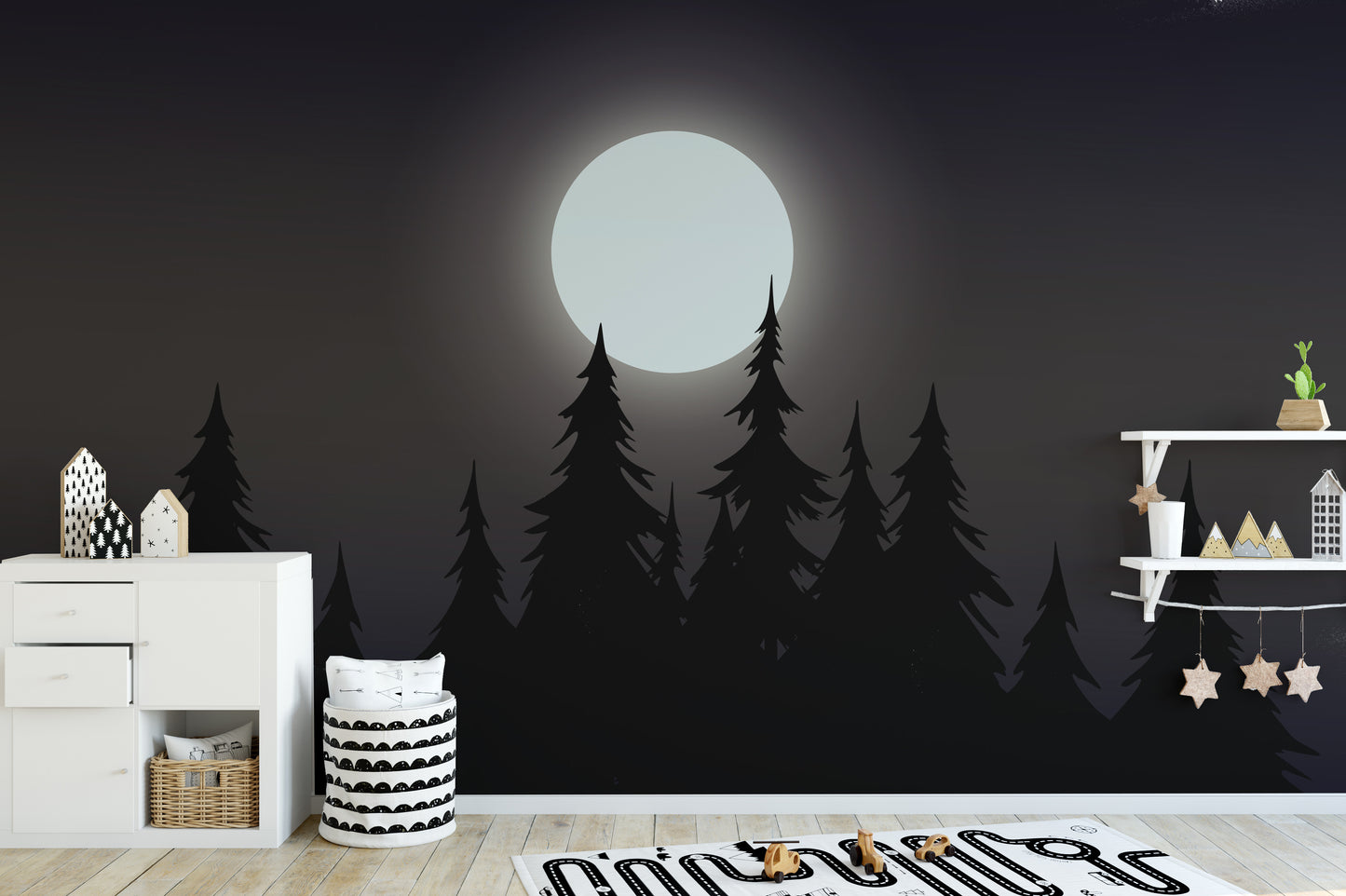 Mystical Moonlit Forest wallpaper with a bright moon and black pines in a kids room with a white dresser and stars