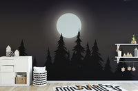 Mystical Moonlit Forest wallpaper with a bright moon and black pines in a kids room with a white dresser and stars