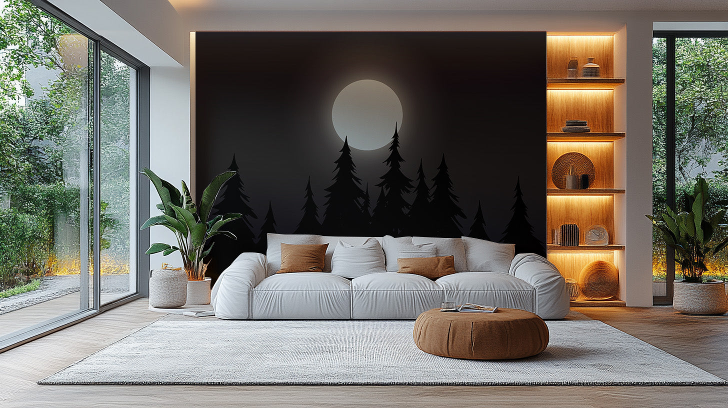 Mystical Moonlit Forest wallpaper with a soft moon over black pines behind a white sofa in a living room