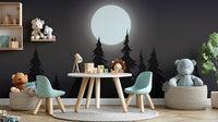Mystical Moonlit Forest wallpaper with moon and black pines in a kids playroom with teddy bears and toys
